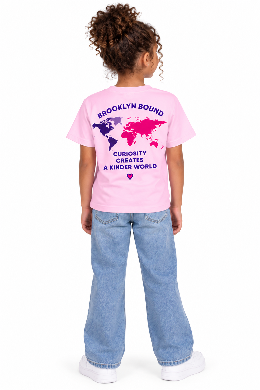 Youth model wearing the light pink short sleeve t-shirt, back view